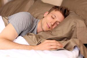 guy sleeping on a pillow