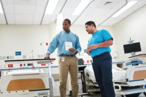 Two people in hospital room